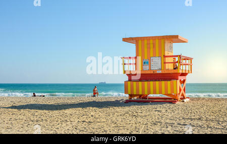 MIAMI, USA - November 23, 2015 : Lifeguard house with lifeguard and a s swimmer on the beach Stock Photo