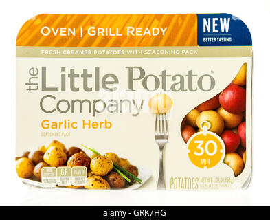 Winneconne, WI - 1 August 2016: Package of The little potato company oven or grill ready potatoes in garlic herb flavor on an is Stock Photo