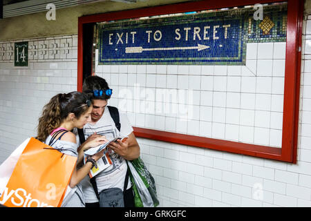 New York City,NY NYC Manhattan,Union Square,14th Street-Union Square,subway,station,MTA,adult,adults,man men male,woman female women,young adult,coupl Stock Photo