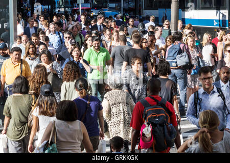 New York City,NY NYC Manhattan,Midtown,42 Street,intersection,crowded crosswalk,multi ethnic multiethnic,Black Asians,Hispanic Latinos,adult,adults,ma Stock Photo
