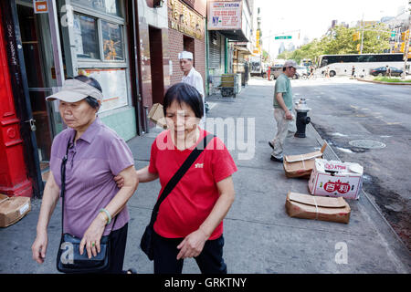 New York City,NY NYC,Lower Manhattan,Chinatown,Allen Street,Chinese,Asian Asians ethnic immigrant immigrants minority,adult adults,woman women female Stock Photo
