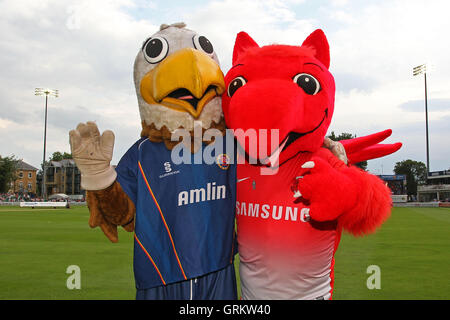 Eddie the Eagle (L) poses for a photo with Leyton Orient mascot Theo the Wyvern - Essex Eagles vs Sussex Sharks - NatWest T20 Blast Cricket at the Essex County Ground, Chelmsford, Essex - 25/07/14 Stock Photo