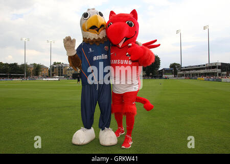 Eddie the Eagle (L) poses for a photo with Leyton Orient mascot Theo the Wyvern - Essex Eagles vs Sussex Sharks - NatWest T20 Blast Cricket at the Essex County Ground, Chelmsford, Essex - 25/07/14 Stock Photo