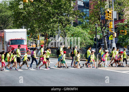 New York City,NY NYC Lower Manhattan,Chinatown,East Broadway,intersection,crosswalk,crossing street,Asian adult,adults,man men male,woman female women Stock Photo