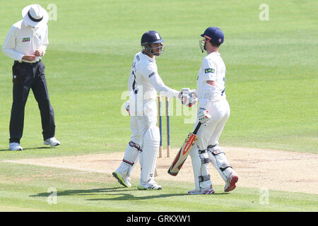 Ravi Bopara reaches 150 runs for his team and is congratulated by James Foster (R) - Kent CCC vs Essex CCC - LV County Championship Division Two Cricket at the St Lawrence Ground, Canterbury - 09/06/14 Stock Photo