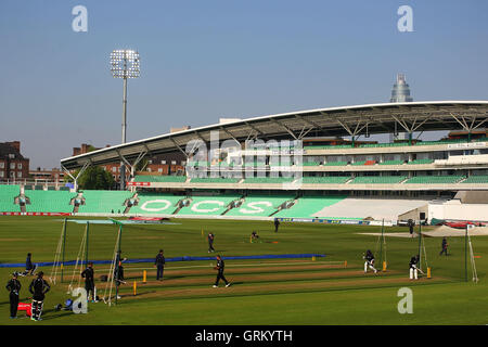 General view of the ground as the players warm up ahead of Day Two - Surrey CCC vs Essex CCC - LV County Championship Division Two Cricket at the Kia Oval, Kennington, London - 21/04/14 Stock Photo