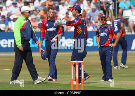 James Foster of Essex (C) protests to umpire George Sharp after 12 penalty runs are added to the Sussex score for a slow over rate - Essex Eagles vs Sussex Sharks - Friends Life T20 Cricket at the Essex County Ground, Chelmsford - 14/07/13 Stock Photo