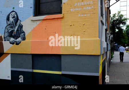 Mural of a child laughing along Christopher Columbus Drive in Historic Downtown,Jersey City,New Jersey,USA Stock Photo