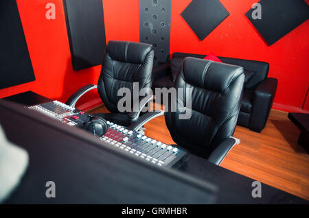 Classy professional recording studio setup, large desk with mixing ...