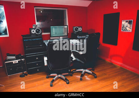 Classy professional recording studio setup, large desk with mixing ...