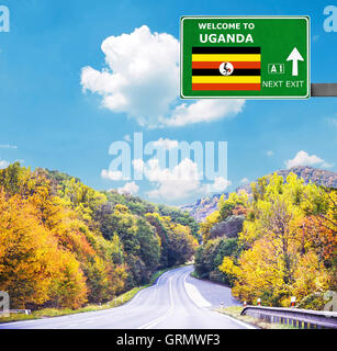 Uganda road sign against clear blue sky Stock Photo