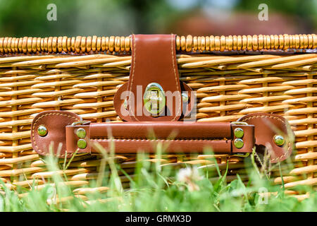 Picnic Basket Hamper With Leather Handle In Green Grass Stock Photo