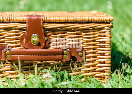 Picnic Basket Hamper With Leather Handle In Green Grass Stock Photo