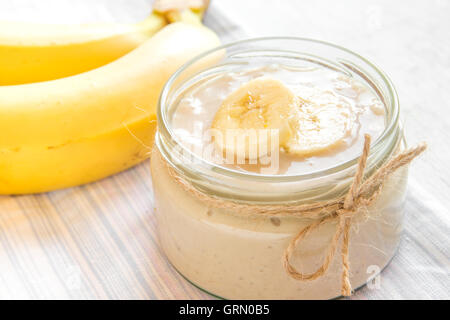 Banana mousse (pudding) for healthy vegetarian dessert over white background Stock Photo