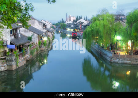 The buildings and water canals of Fengjing Town in Shanghai China at dusk. Stock Photo