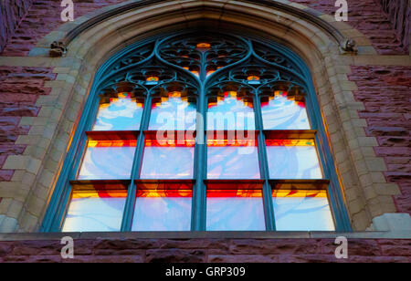 Close-Up Detail of Front Facade Arcing Window Illuminated on Saint James United Church, Montreal, Quebec, Canada Stock Photo