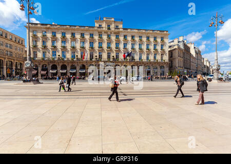 BORDEAUX, FRANCE - APRIL 4, 2011: French people walking in front of Regent hotel on Grand Theatre square Stock Photo