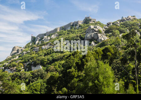 The Castle of the Moors (Portuguese: Castelo dos Mouros) is a hilltop medieval castle located in Sintra, Portugal. Stock Photo