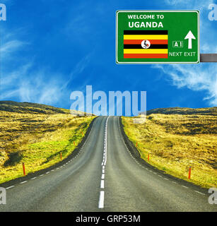 Uganda road sign against clear blue sky Stock Photo