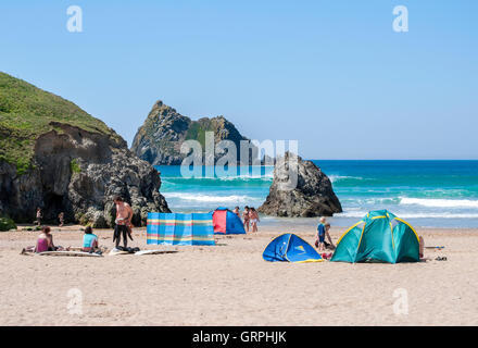Families on the beach at Holywell bay in Cornwall, England, UK Stock Photo