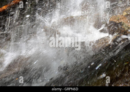 Splashing Water on Rocks Stock Photo