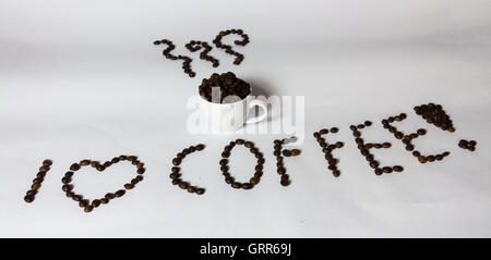 I love coffee. Coffee cup with steam and letters made from coffee beans. Creative, original. Stock Photo