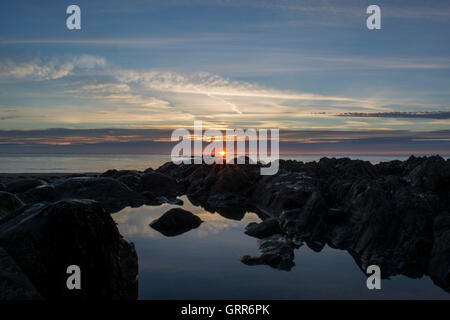 Sunset on the beach at Porth North Cornwall UK Stock Photo - Alamy