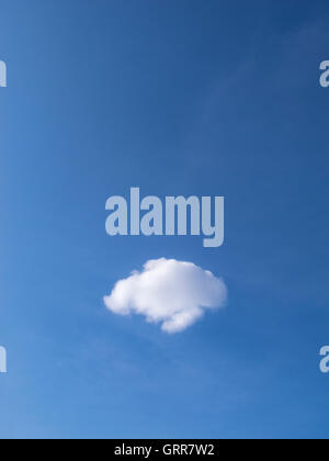 A lone perfect cloud in a blue sky Stock Photo