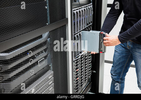 Male Computer Engineer Installing Blade Server In Chassis Stock Photo