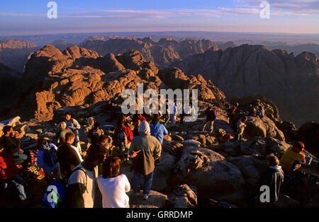 Pilgrims and tourists on the summit of Mount Sinai (mt 2285) at dawn, Egypt, Asia Stock Photo