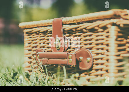 Picnic Basket Hamper With Leather Handle In Green Grass Stock Photo