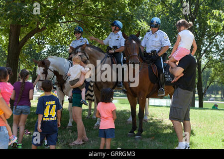 US Park Police on horseback interacting with public - USA Stock Photo