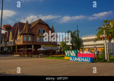 BLUMENAU, BRAZIL - MAY 10, 2016: colorfull sign of blumenau located in front of an ancient german style house in the city center Stock Photo