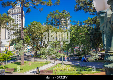 CURITIBA ,BRAZIL - MAY 12, 2016: some people relaxing at a park in the downtown of the city Stock Photo