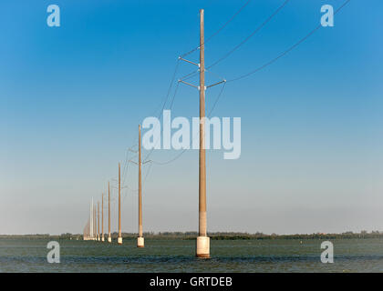 Hydro line crossing Tarpon Bay Stock Photo