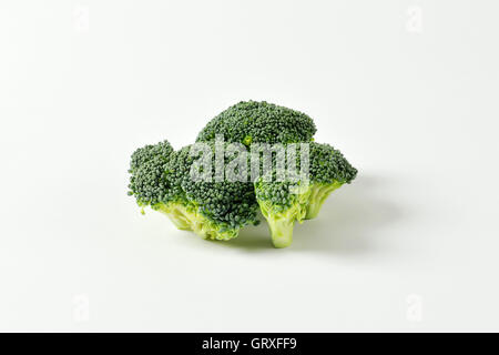 Fresh broccoli on off-white background Stock Photo
