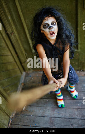 Witch on broom Stock Photo