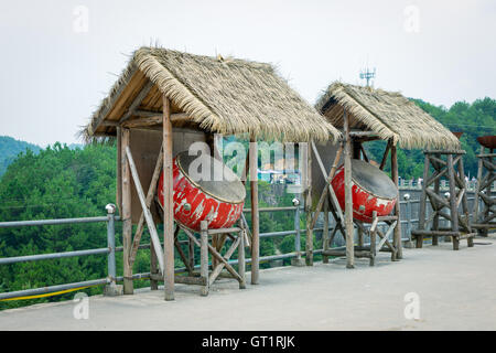 old drum with hay hut Stock Photo