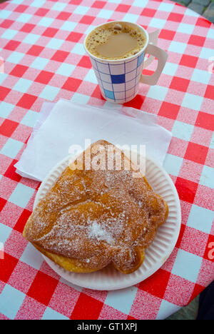 PIg shaped doughnut and coffee in paper cup, typical afternoon snack, cafe, Kauppatori, market square, Helsinki, Finland Stock Photo