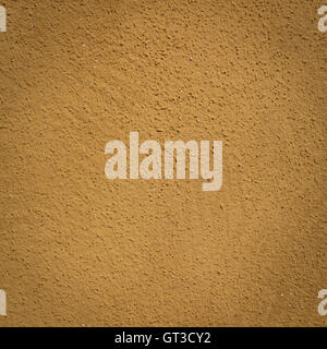 Mustard wall background and texture with vignetting and blank copyspace for text or advertising. Stock Photo