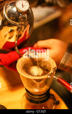 Close up of filter coffee brewing kit and kettle, cafe barista preparing  filter at the counter 35829609 Stock Photo at Vecteezy