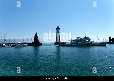 Ferry boat the Bavarian lion and the new lighthouse built in 1856 in Lindau at Lake Constance, Bodensee,  Swabia, Bavaria, Stock Photo