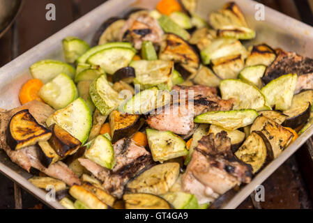 Chicken baked in oven with eggplant and zucchini Stock Photo