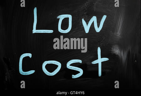 Low cost handwritten with white chalk on a blackboard Stock Photo