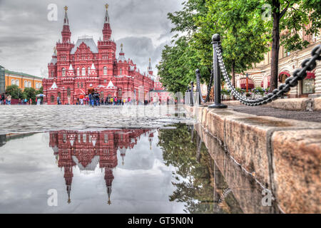 Building of Historical museum reflecting in puddle on the Red Square, Moscow, Russia Stock Photo