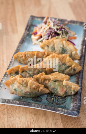 Korean Style Gyoza, Vegeterian Potstickers with soy sauce and pork Stock Photo