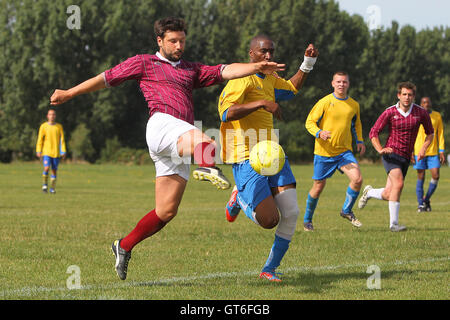 Jay Cubed (yellow/blue) vs Bristow City - Hackney & Leyton Sunday League Football at South Marsh, Hackney Marshes, London - 01/09/13 Stock Photo