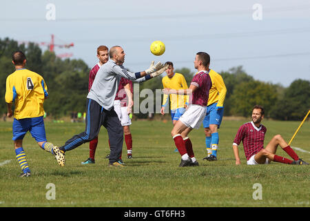 Jay Cubed (yellow/blue) vs Bristow City - Hackney & Leyton Sunday League Football at South Marsh, Hackney Marshes, London - 01/09/13 Stock Photo