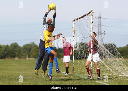 Jay Cubed (yellow/blue) vs Bristow City - Hackney & Leyton Sunday League Football at South Marsh, Hackney Marshes, London - 01/09/13 Stock Photo