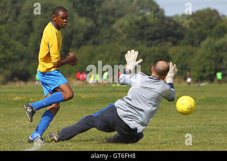 Jay Cubed (yellow/blue) vs Bristow City - Hackney & Leyton Sunday League Football at South Marsh, Hackney Marshes, London - 01/09/13 Stock Photo